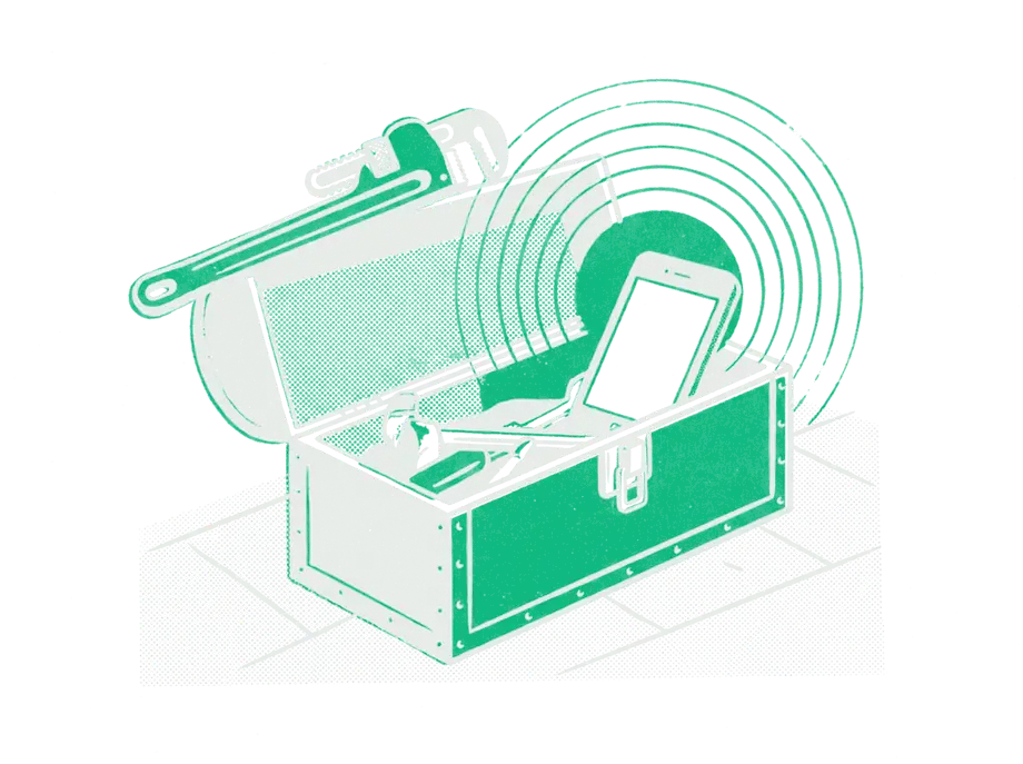 An open toolbox on a tiled floor, a pipe wrench across the lid and a phone inside lighting up emerald