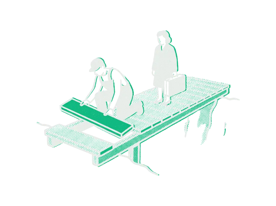 A worker laying an emerald plank at the unfinished end of a footbridge while a traveler waits with a suitcase